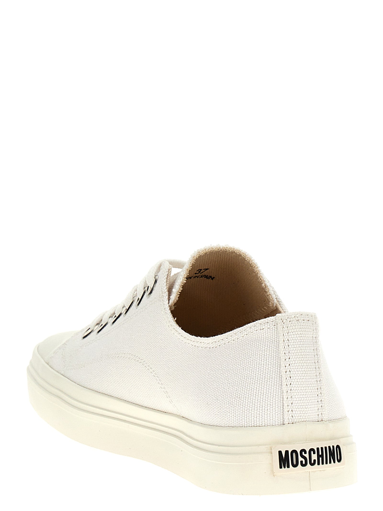 Sneakers by Moschino for women in cotton canvas white presents a on trend silhouette from the Women's Low Top Cotton Canvas Sneakers collection, showcasing a on trend low-top style for an elevated aesthetic.