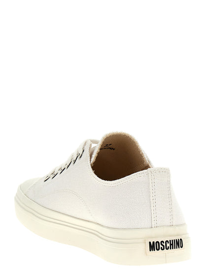 Sneakers by Moschino for women in cotton canvas white presents a on trend silhouette from the Women's Low Top Cotton Canvas Sneakers collection, showcasing a on trend low-top style for an elevated aesthetic.