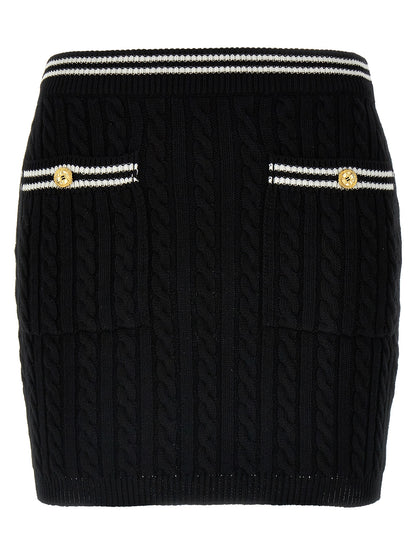 Skirt by Alessandra Rich for women in cotton bicolour, black & white features a contoured silhouette from the Women's Cotton Mini Long Skirt collection, characterized by its contoured mini long for a contoured finish.