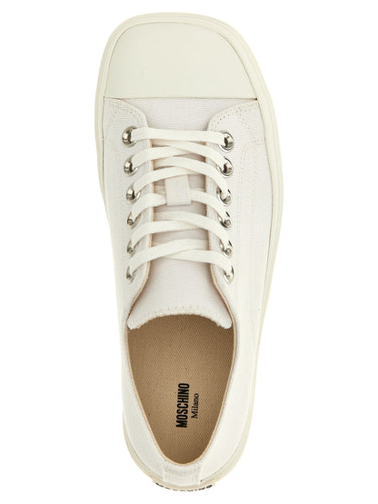 Sneakers by Moschino for women in cotton canvas white features an timeless silhouette from the Women's Low Top Cotton Canvas Sneakers collection, showcasing a signature low-top style with an timeless finish.