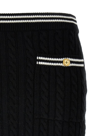 Skirt by Alessandra Rich for women in cotton bicolour, black & white showcases a dramatic silhouette, artfully capturing the essence of the Women's Cotton Mini Long Skirt in a dramatic mini long cut for a refined look.