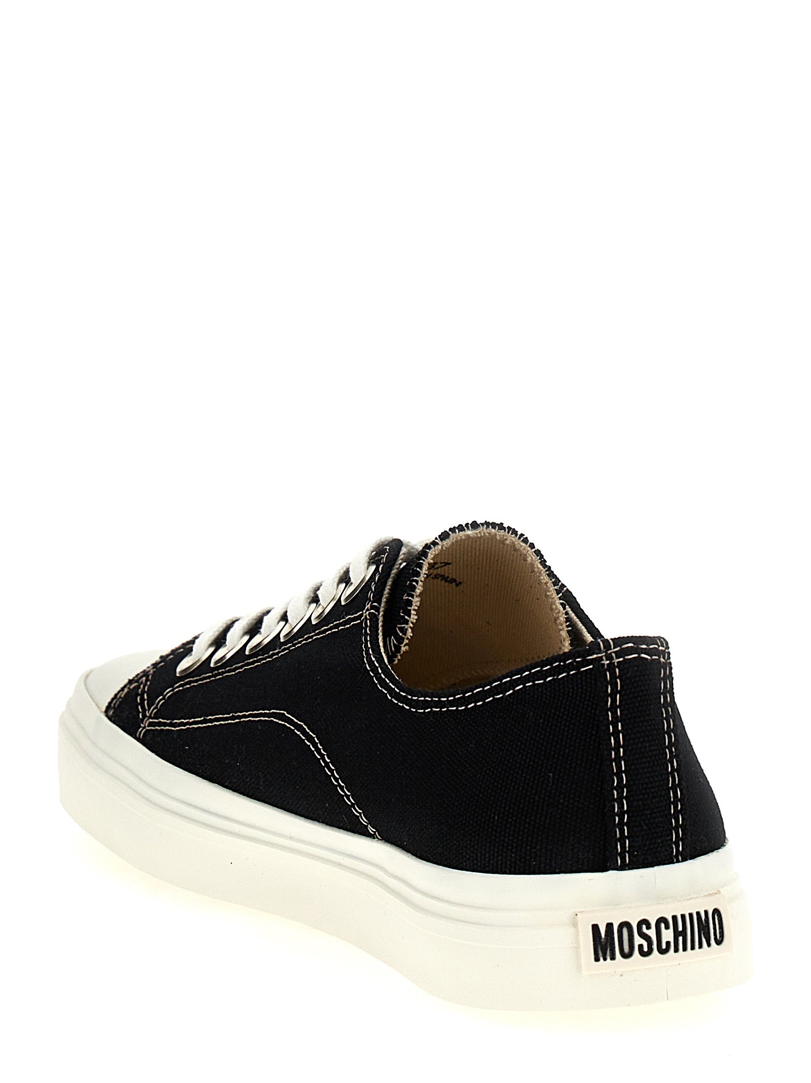 Sneakers by Moschino for women in cotton canvas black presents a impeccable silhouette as Women's Low Top Cotton Canvas Sneakers, expertly defined by a impeccable low-top style for a impeccable, high-fashion look.