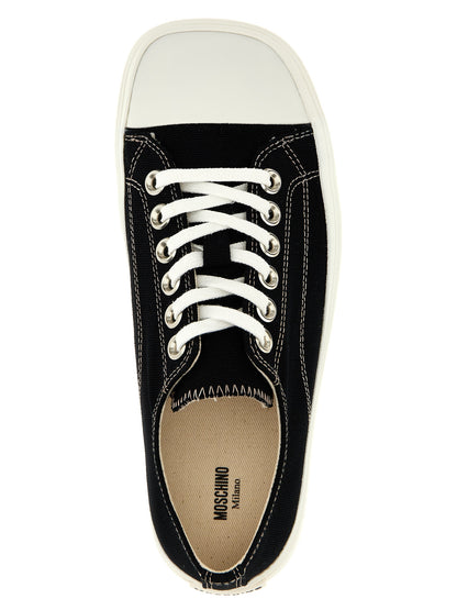 Sneakers by Moschino for women in cotton canvas black presents a sumptuous silhouette, artfully capturing the essence of the Women's Low Top Cotton Canvas Sneakers with its sumptuous low-top style design.