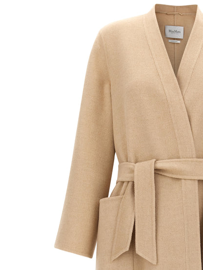 Overcoat by Max Mara for women in wool beige & camel showcases a enveloping silhouette, detailed with distinctive pockets and a enveloping split neckline.