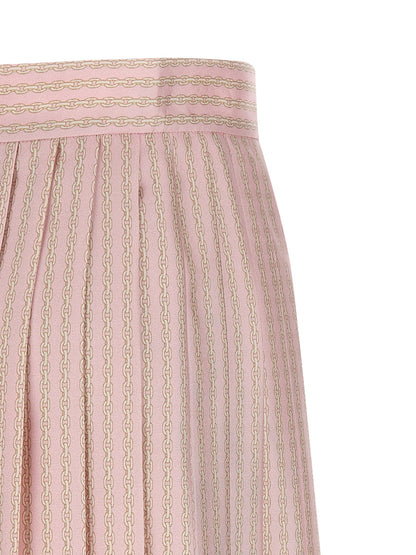 Skirt by Versace for women in silk twill multicolor, pink & print showcases a sultry silhouette, elegantly defined by its mini long and the sophisticated sultry design of the Women's Silk Twill Mini Long Skirt.