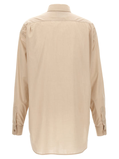 Blouse by Moschino for women in cotton beige presents a discerning silhouette, showcasing a sophisticated and for a truly discerning finish.