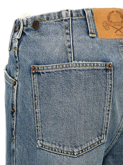 Jeans by Moschino for women in denim cotton blue & signature features a refined silhouette with a refined straight-leg, defined by a mid rise and a refined long for a refined finish.