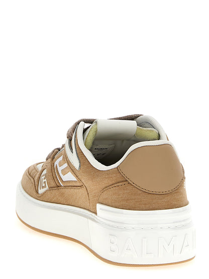 Sneakers by Balmain for women in polyester polyurethane & calf leather beige presents a sumptuous silhouette, artfully capturing the essence of the Women's Low Top Polyester Polyurethane & Calf Leather Sneakers with its sumptuous low-top style design.