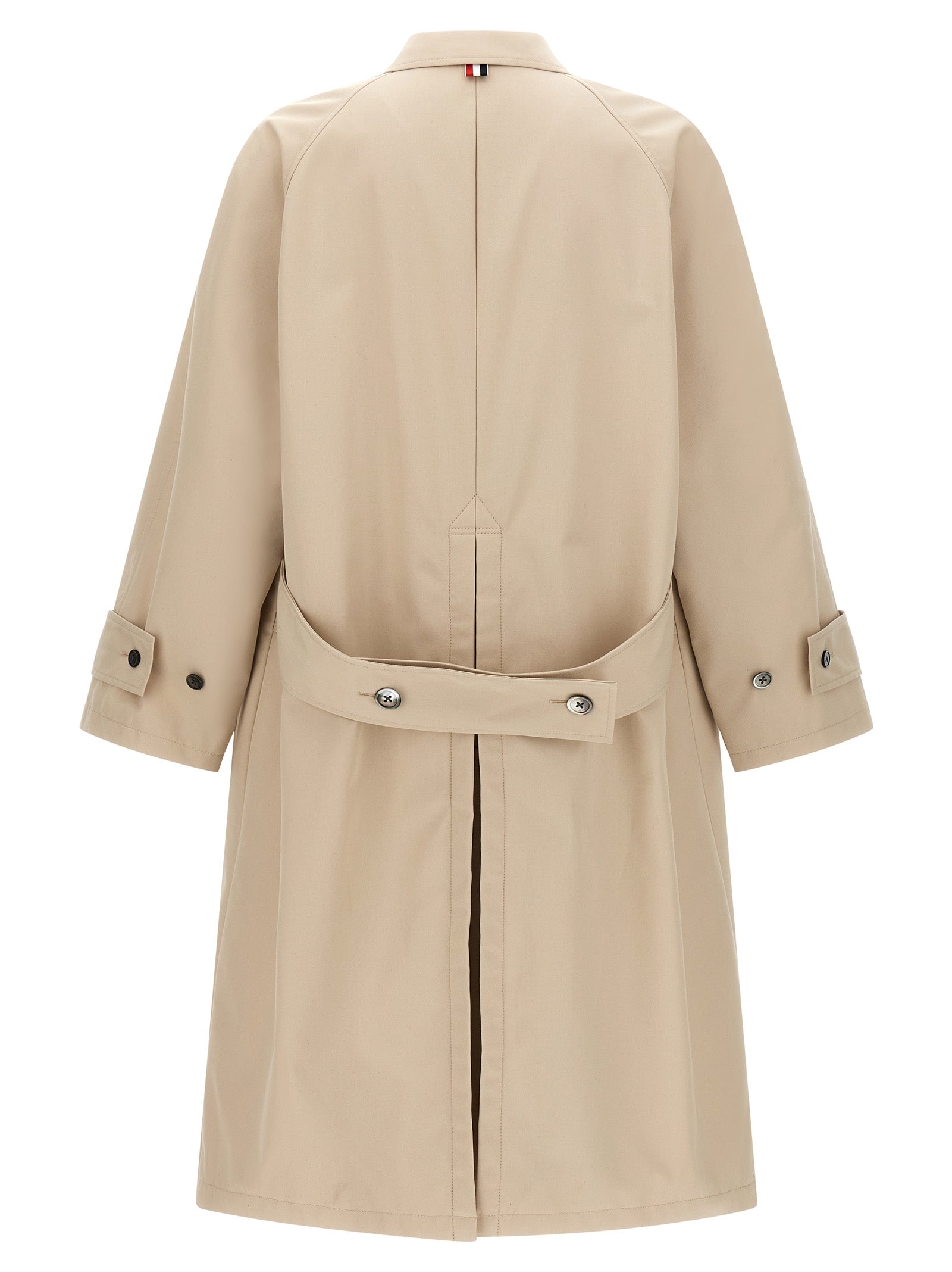 Trench Coat by Thom Browne for men in polyester polyurethane cotton and beige presents a exquisite silhouette, showcasing a exquisite and functional pockets for an elevated aesthetic.