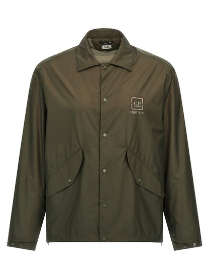 Overshirt by C.P. Company for men in polyamide bicolour & green showcases a sleek silhouette, elegantly detailed with a sleek and for a sleek finish.