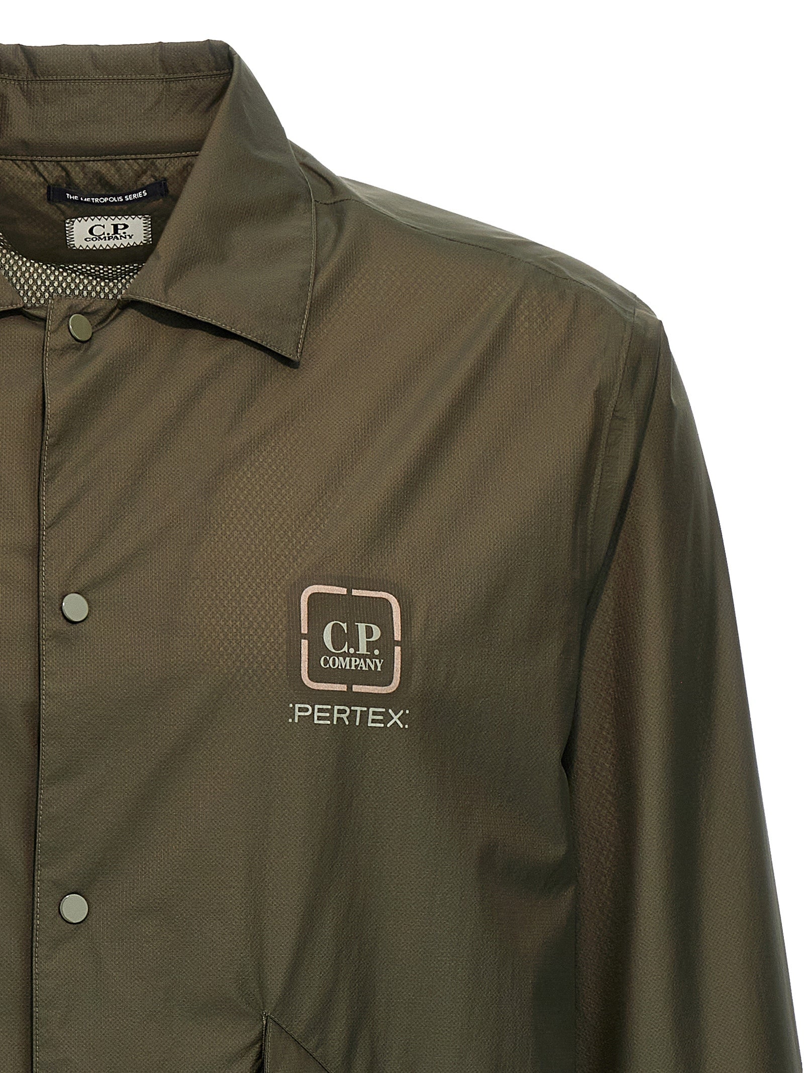 Overshirt by C.P. Company for men in polyamide bicolour & green features an architectural silhouette with a refined and elegant for a architectural look.