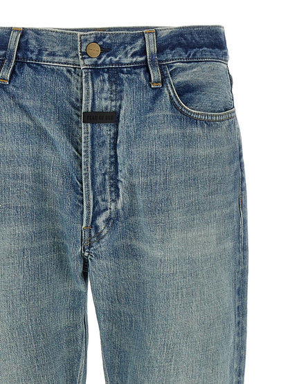 Jeans by Fear Of God for men in cotton denim blue presents a tailored silhouette, showcasing a tailored straight-leg and long cut with a refined for a truly tailored aesthetic.