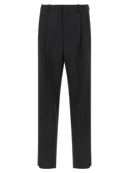 Trousers by Saint Laurent for men in satin wool black features an on trend silhouette, showcasing a sophisticated with a long and high rise for an on trend finish.