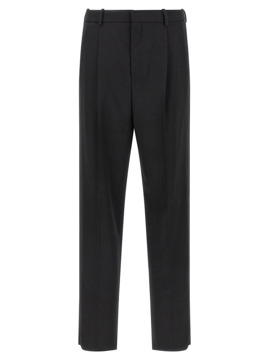 Trousers by Saint Laurent for men in satin wool black features an on trend silhouette, showcasing a sophisticated with a long and high rise for an on trend finish.