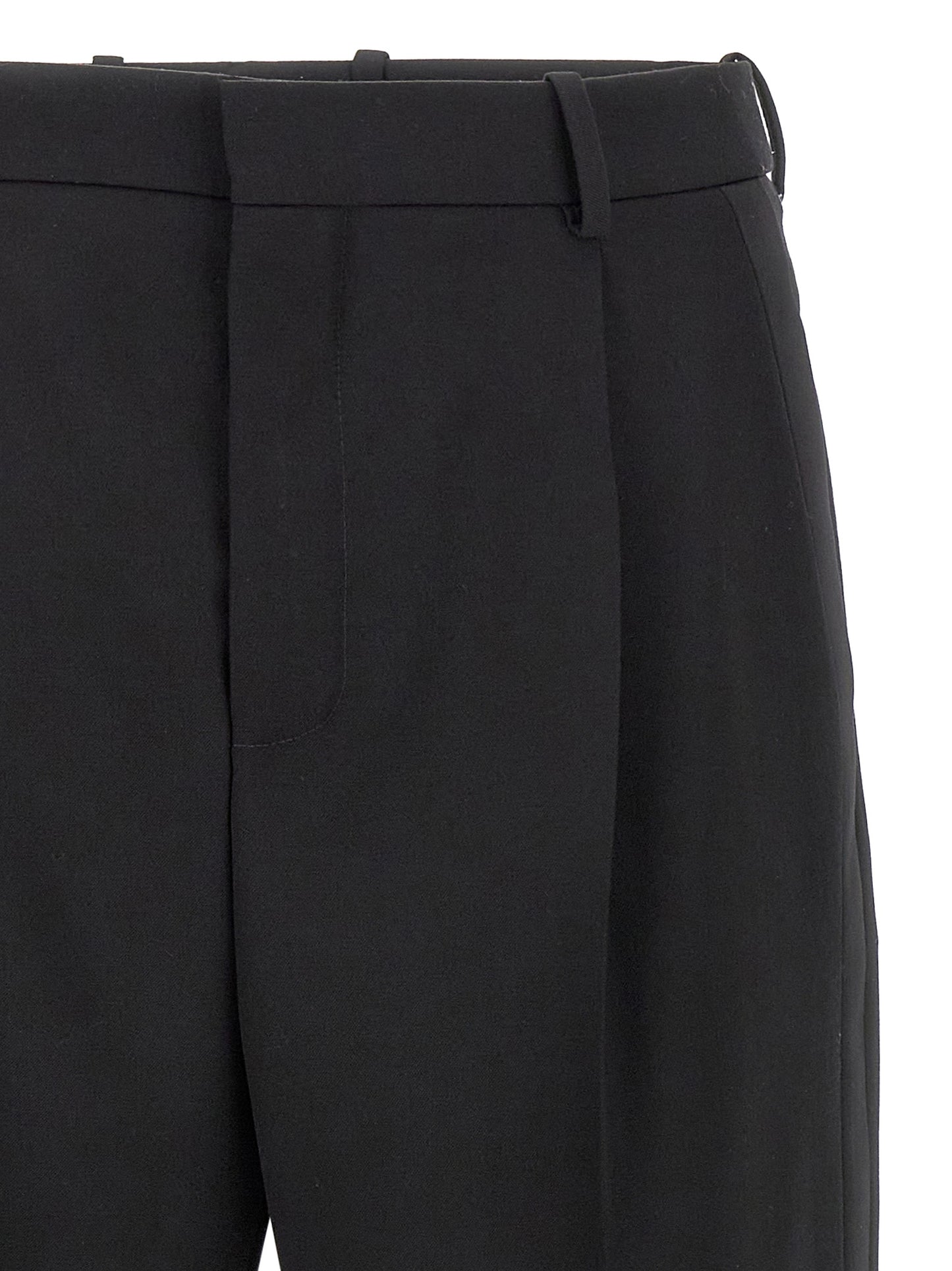 Trousers by Saint Laurent for men in satin wool black features a artisanal silhouette, showcasing a sophisticated with a long and high rise for a artisanal finish.