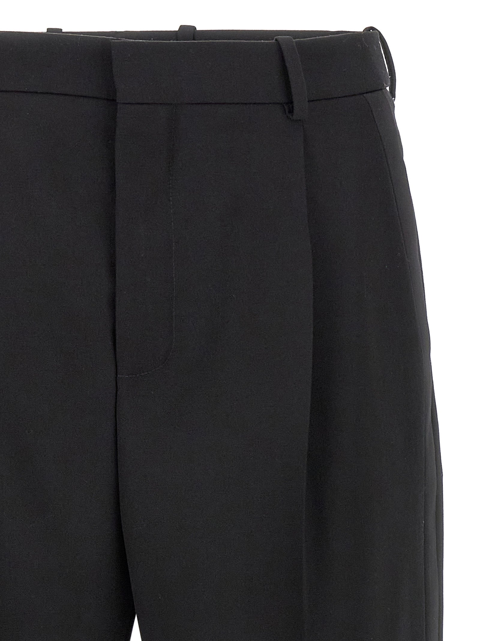 Trousers by Saint Laurent for men in satin wool black features a artisanal silhouette, showcasing a sophisticated with a long and high rise for a artisanal finish.