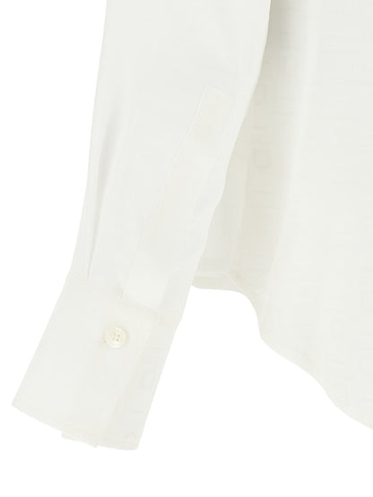 Blouse by Ferragamo for women in silk white, jacquard & monogram showcases a sharp silhouette, elegantly detailed with a sharp and sharp .