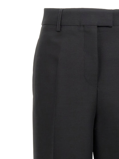 Trousers by Ferragamo for women in viscose & virgin wool black features a artisanal silhouette, showcasing a sophisticated straight-leg with a long and for a artisanal finish.