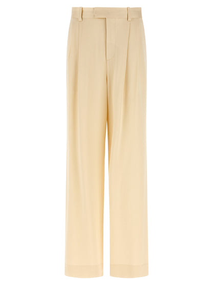 Trousers by Armarium for women in viscose beige features a sculptural silhouette, showcasing a sculptural straight-leg & wide and long with a sophisticated high rise for a sculptural finish.