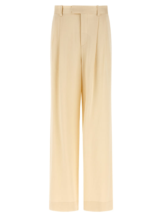 Trousers by Armarium for women in viscose beige features a sculptural silhouette, showcasing a sculptural straight-leg & wide and long with a sophisticated high rise for a sculptural finish.