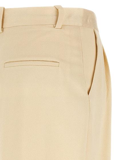 Trousers by Armarium for women in viscose beige features an on trend silhouette, showcasing a sophisticated straight-leg & wide with a long and high rise for an on trend finish.