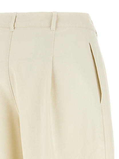 Casual Pants by A.P.C. for women in cotton beige features an refined tailoring silhouette, showcasing a premium straight-leg with a high rise and long cut for a refined tailoring look.