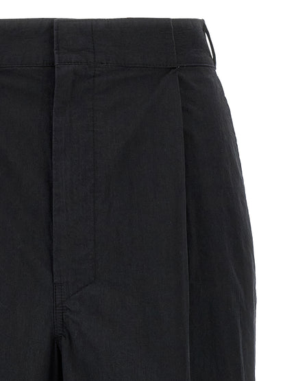 Trousers by Maison Margiela for women in polyamide cotton black & signature features a artisanal silhouette, showcasing a sophisticated straight-leg & wide with a long and for a artisanal finish.