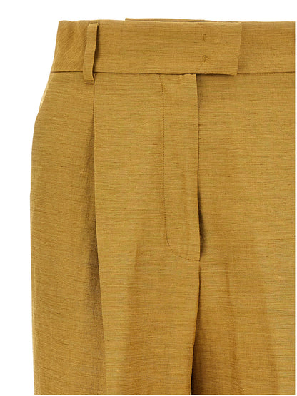 Trousers by Max Mara for women in polyamide silk gold presents a smart silhouette, meticulously detailed with a smart straight, a smart long, and a smart high rise.