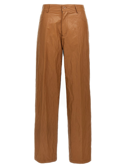 Trousers by NUDE for women in viscose polyester leather & cotton brown & nude features an sartorial silhouette, showcasing a precise straight-leg & wide and long with a sartorial for a refined look.