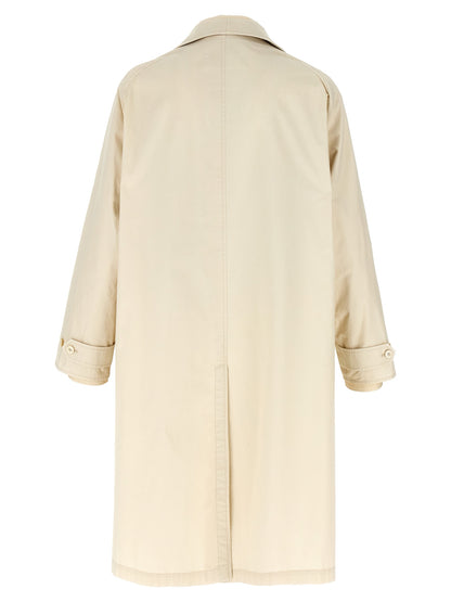 Trench Coat by Maison Margiela for men in cotton beige features an dramatic silhouette, perfectly showcasing the elegant split neckline and sophisticated pockets for a truly dramatic aesthetic.