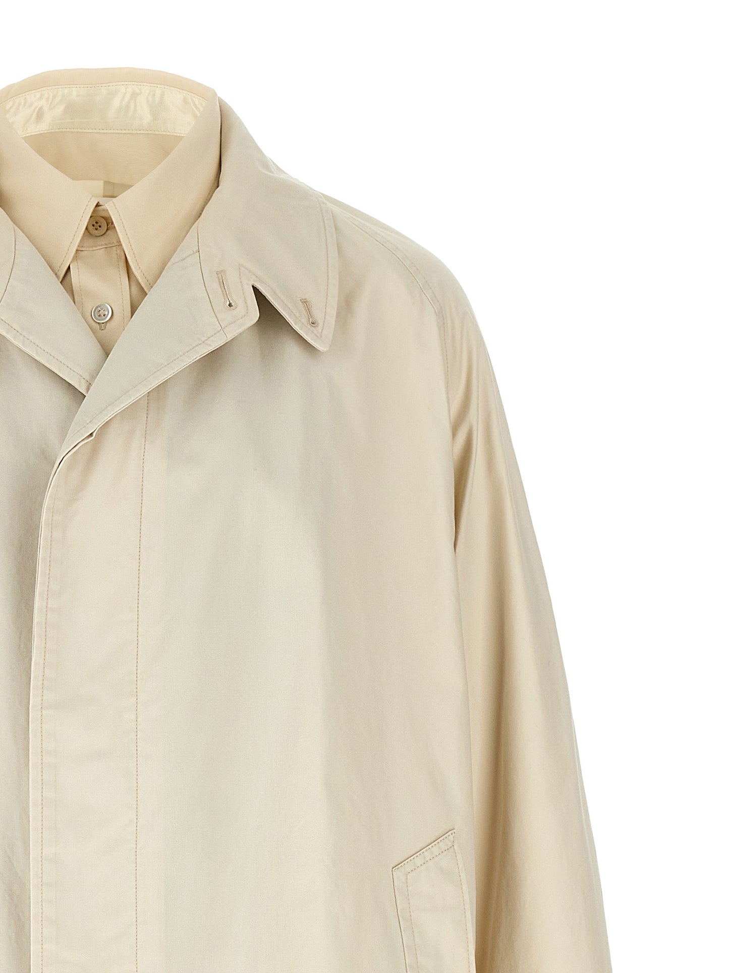 Trench Coat by Maison Margiela for men in cotton beige presents a distinguished silhouette, artfully detailed with pockets and a distinguished split neckline for a sophisticated, distinguished finish.
