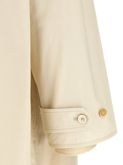 Trench Coat by Maison Margiela for men in cotton and beige presents a exquisite silhouette, showcasing a exquisite and functional pockets for an elevated aesthetic.
