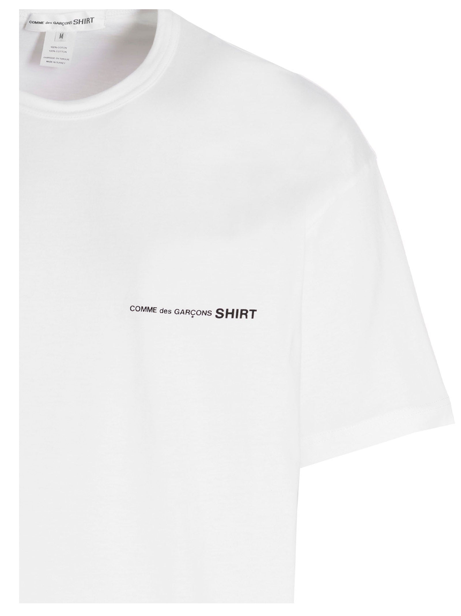 T-Shirt by Comme Des Garçons for men in cotton white showcases a fashionable silhouette, elegantly detailed with a fashionable and crew neckline for a sophisticated, high-fashion look.