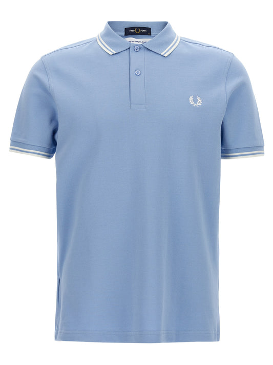 Polo Shirt by Comme Des Garçons for men in cotton light-blue & print presents a crisp silhouette, artfully detailed with a crisp short-sleeve and crisp .