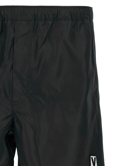 Swim Shorts by Valentino Garavani for men in nylon & mesh black features a refined silhouette, showcasing the premium design of this Heart Men's Nylon & Mesh Swim Shorts.