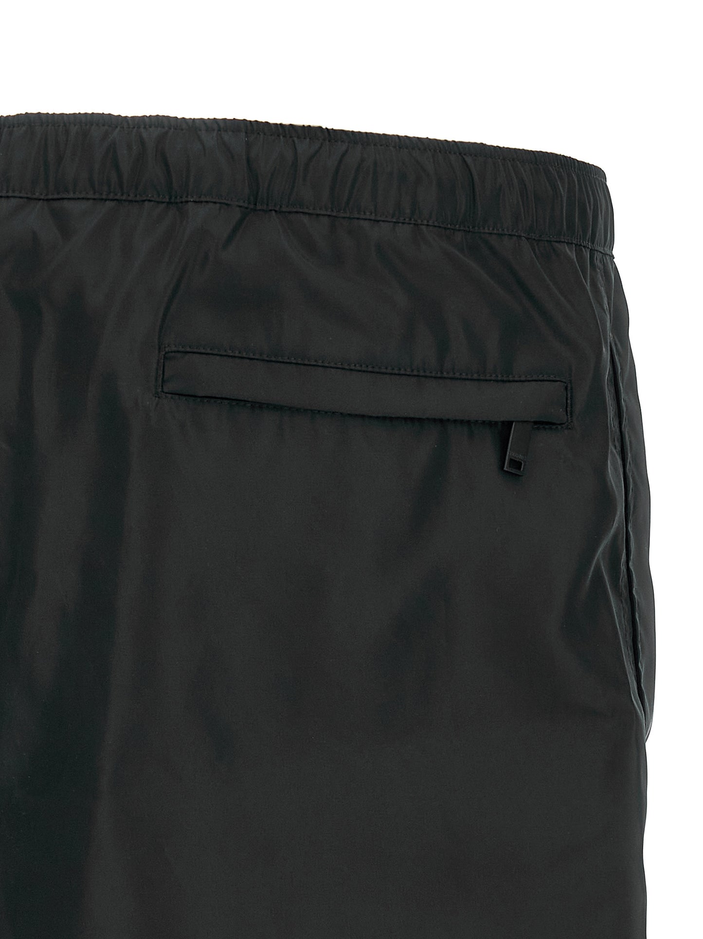 Swim Shorts by Valentino Garavani for men in nylon & mesh black features a beach chic silhouette, showcasing the signature style of the Heart Men's Nylon & Mesh Swim Shorts.