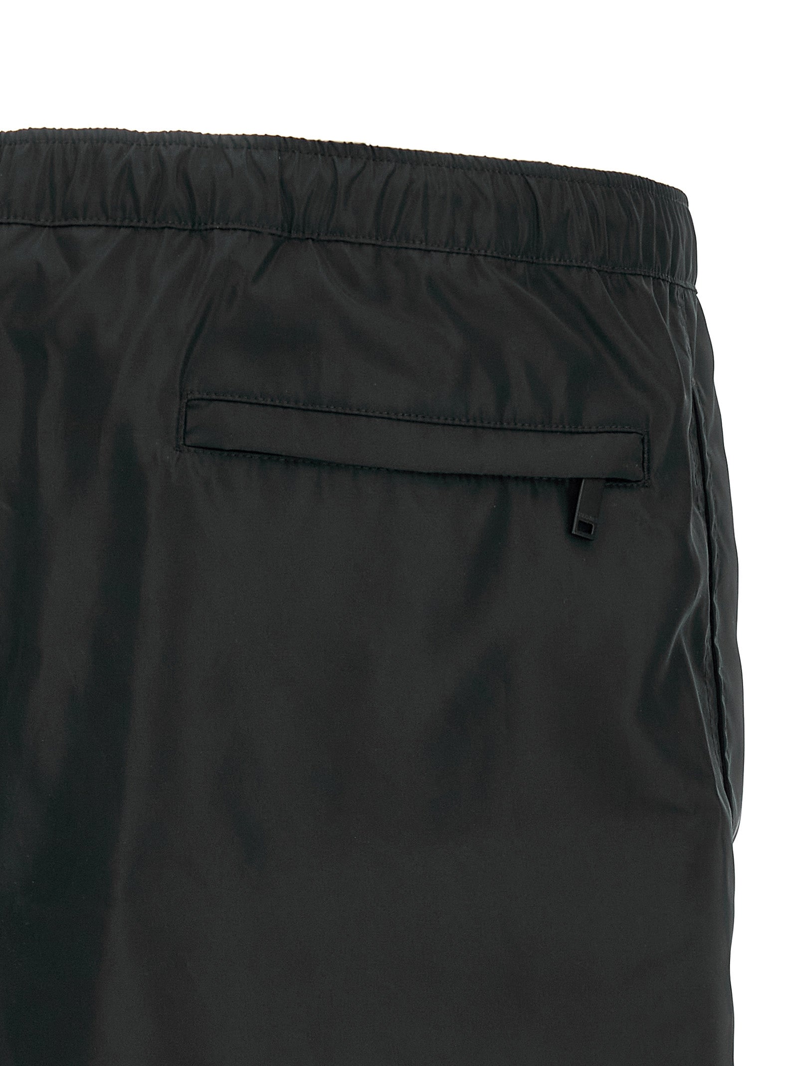 Swim Shorts by Valentino Garavani for men in nylon & mesh black features a beach chic silhouette, showcasing the signature style of the Heart Men's Nylon & Mesh Swim Shorts.