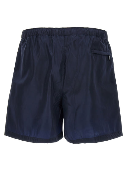 Swim Shorts from Valentino Garavani for men in nylon & mesh blue features an sleek silhouette, showcasing the distinct style of the Men's Nylon & Mesh Swim Shorts collection.