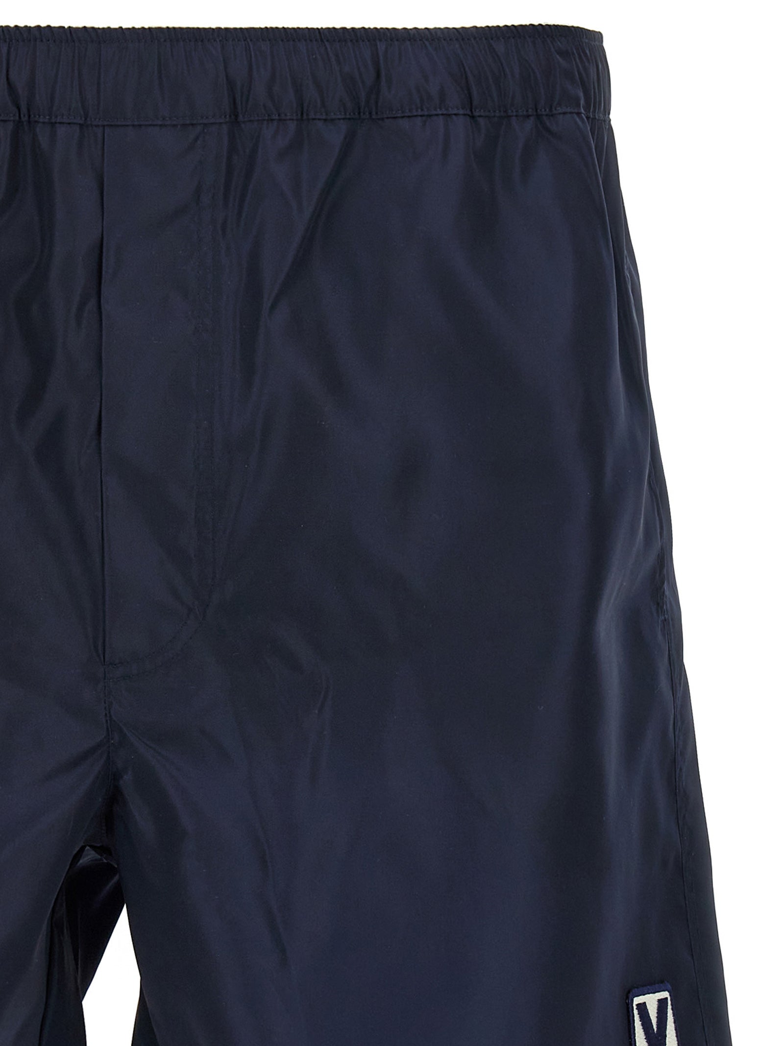 Swim Shorts by Valentino Garavani for men in nylon & mesh blue features a beach chic silhouette, showcasing the signature style of the Men's Nylon & Mesh Swim Shorts.