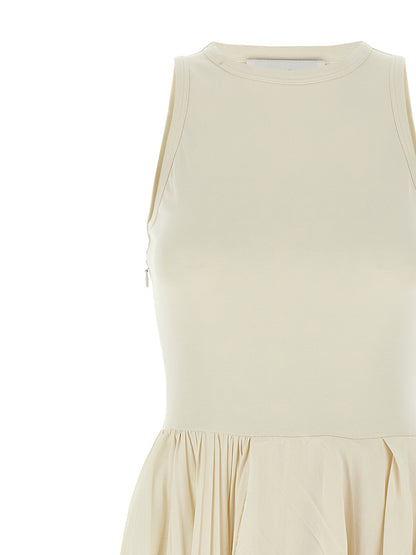 Dress by Alexander McQueen for women in cotton white features a dramatic silhouette, showcasing an elegant crew neckline and that flows into a dramatic long.