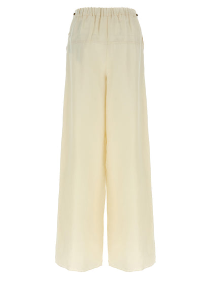 Casual Pants by Max Mara for women in linen flax twill white presents a tailored silhouette, showcasing a tailored wide and long cut with a refined high rise for a truly tailored aesthetic.