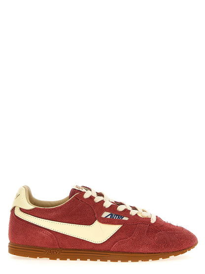 Sneakers by Autry for men in nylon suede leather & cotton terrycloth multicolor, red & jacquard presents a sumptuous silhouette, artfully capturing the essence of the Men's Low Top Nylon Suede Leather & Cotton Terrycloth Sneakers with its sumptuous low-top style design.