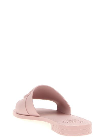 Sliders Flat Shoes by Moncler for women in thermoplastic polyurethane multicolor & pink features an captivating silhouette, showcasing the captivating style of the Women's Thermoplastic Polyurethane Sliders Flat Shoes with its distinct and refined .