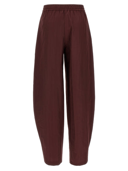 Casual Pants by The Andamane for women in cotton polyester bordeaux features an sartorial flared and long with a low rise cut for a sartorial finish.