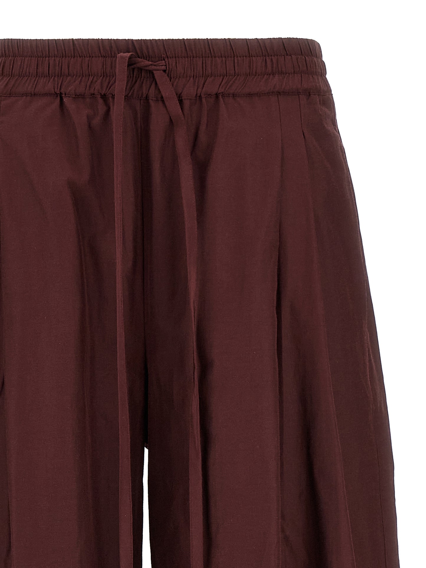 Casual Pants by The Andamane for women in cotton polyester bordeaux features a refined silhouette with a refined flared, defined by a low rise and a refined long for a refined finish.