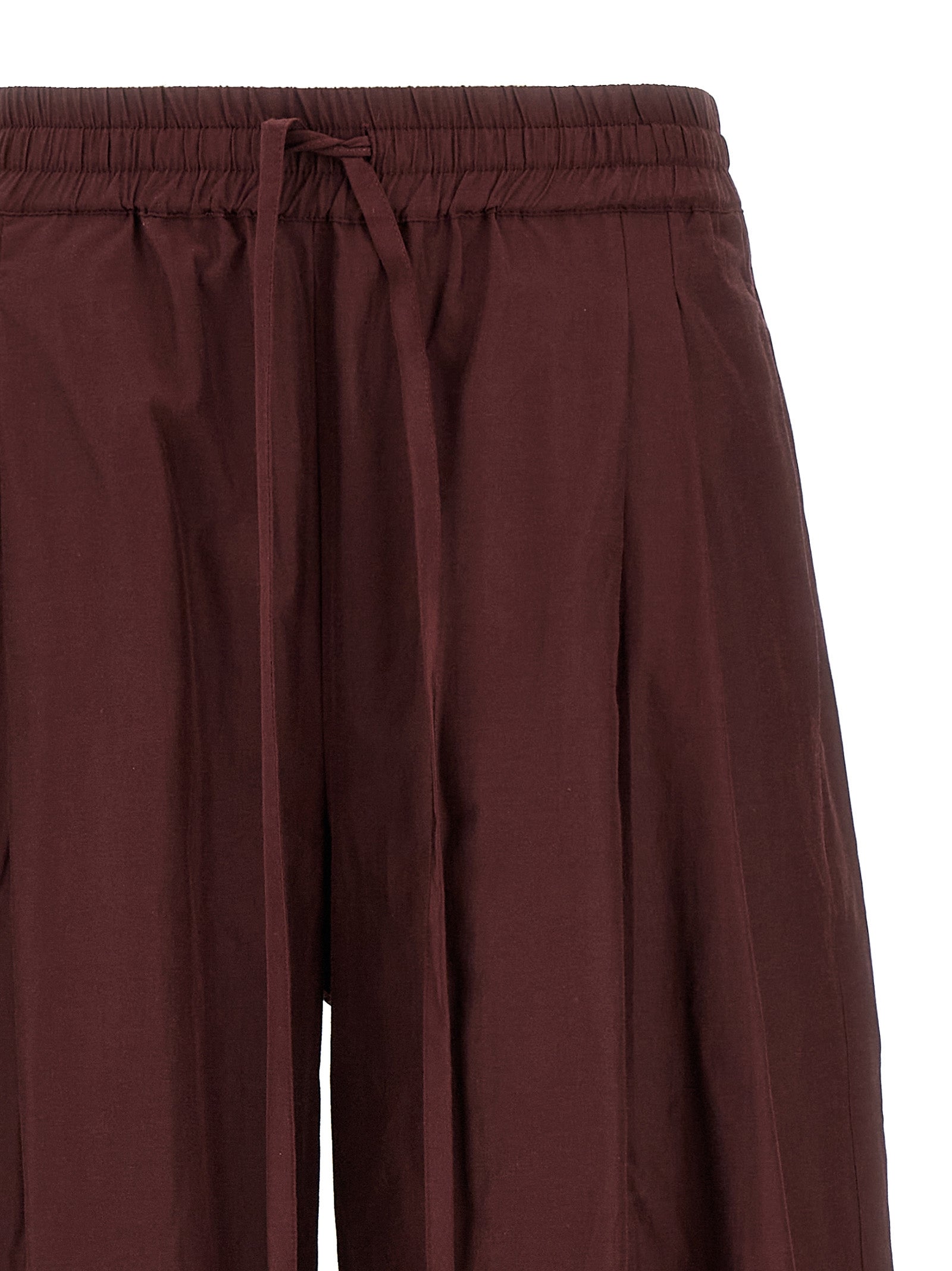 Casual Pants by The Andamane for women in cotton polyester bordeaux features a refined silhouette with a refined flared, defined by a low rise and a refined long for a refined finish.
