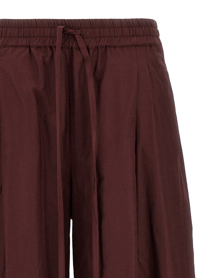 Casual Pants by The Andamane for women in cotton polyester bordeaux features a refined silhouette with a refined flared, defined by a low rise and a refined long for a refined finish.