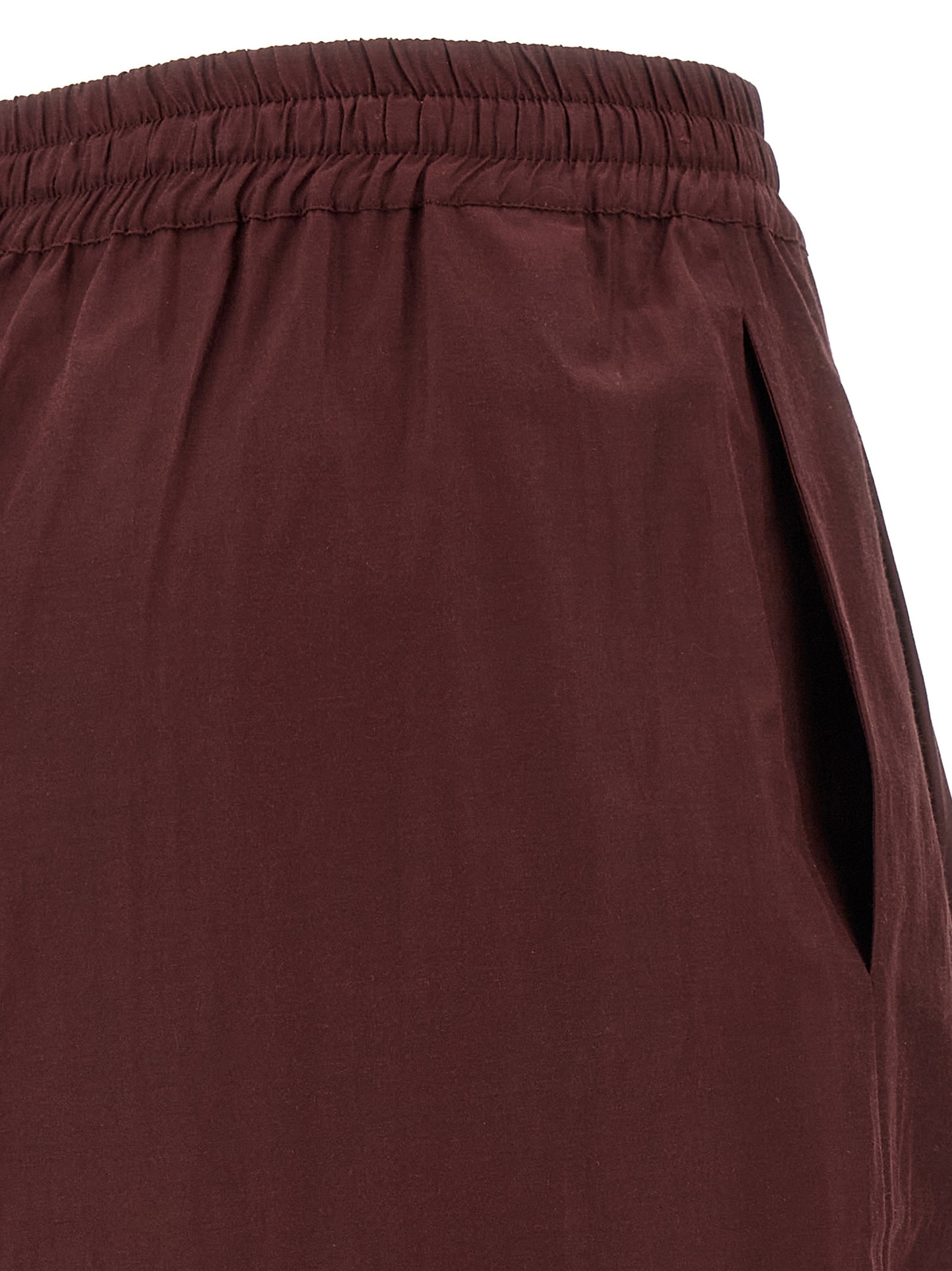 Casual Pants by The Andamane for women in cotton polyester bordeaux features an refined tailoring silhouette, showcasing a premium flared with a low rise and long cut for a refined tailoring look.