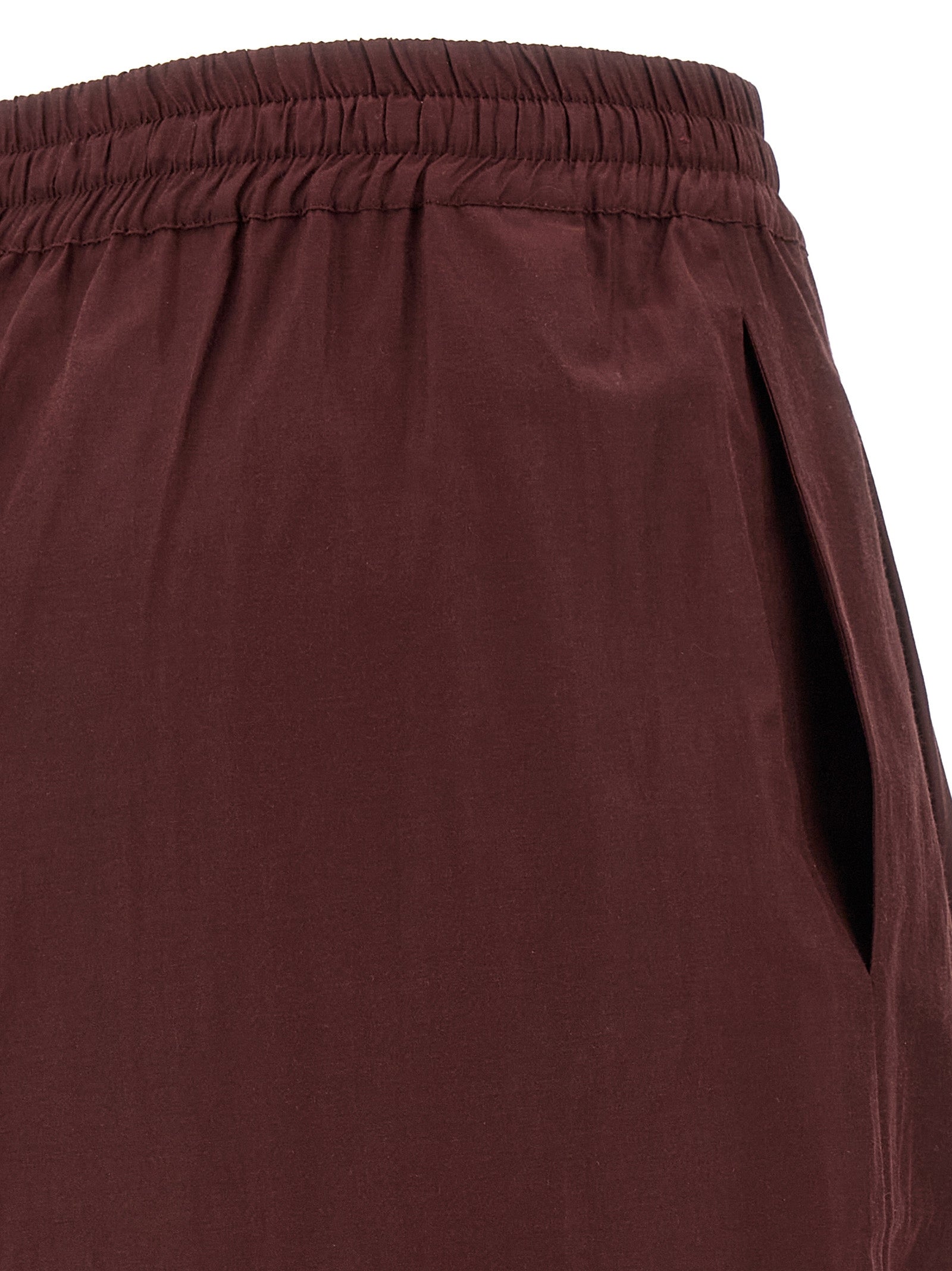 Casual Pants by The Andamane for women in cotton polyester bordeaux features an refined tailoring silhouette, showcasing a premium flared with a low rise and long cut for a refined tailoring look.