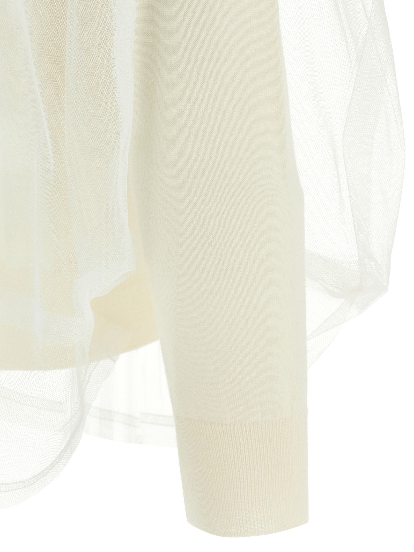 Cardigan by Comme Des Garçons for women in wool white showcases a captivating silhouette, artfully detailed with a captivating and for a truly sophisticated captivating look.